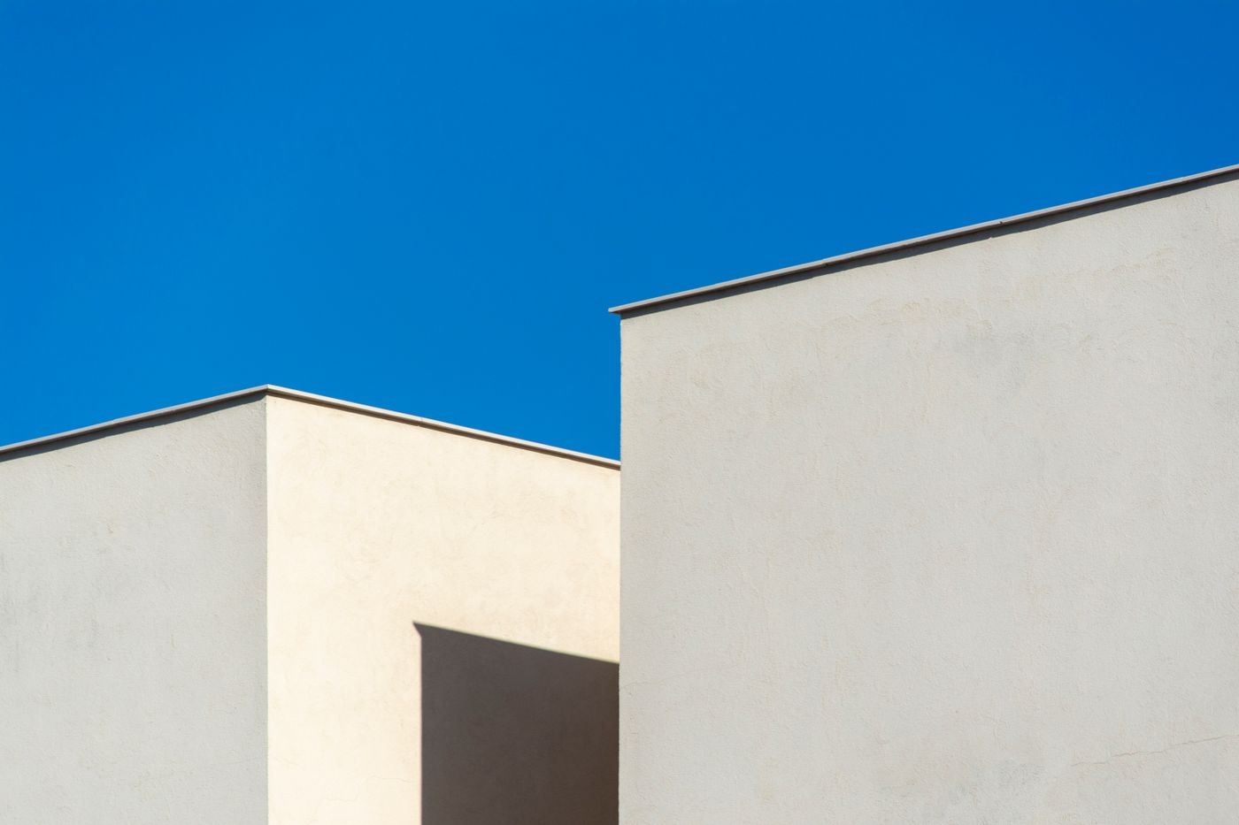 Minimal blue building against the sky