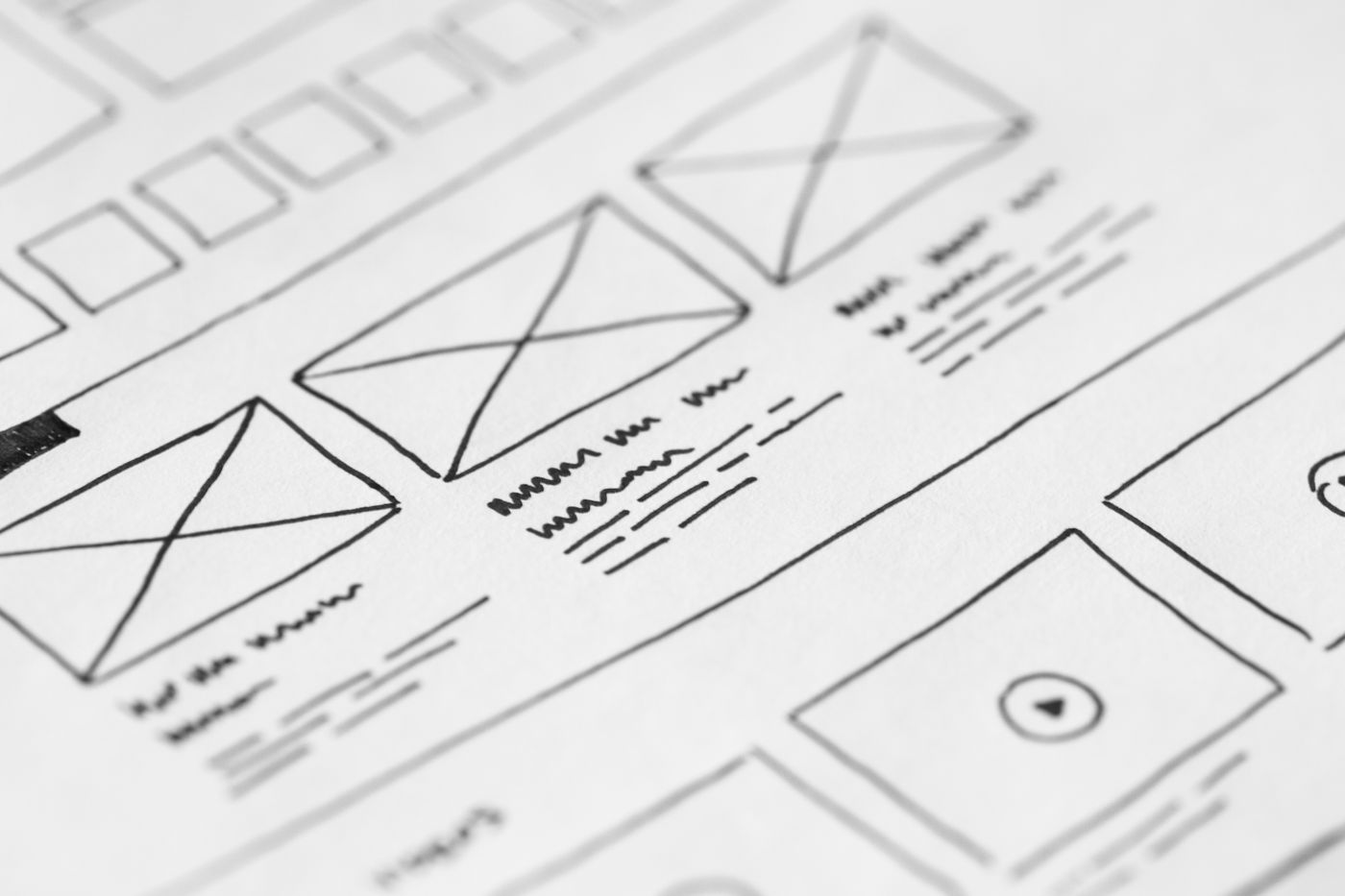 Close-up of pencil wireframes on white paper